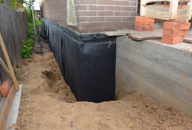 Happy homeowners after waterproofing job in Fairburn